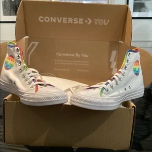Pride high top converse sneakers.